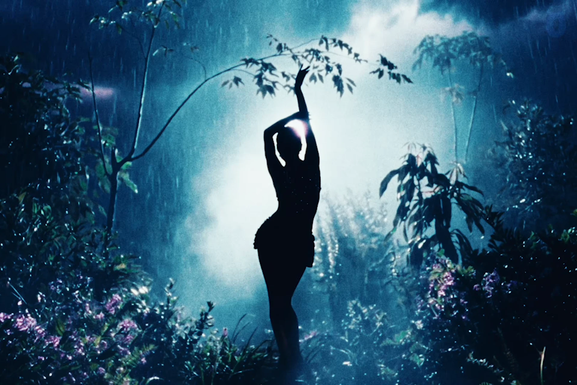 The backlit dance pose in the blue forest set