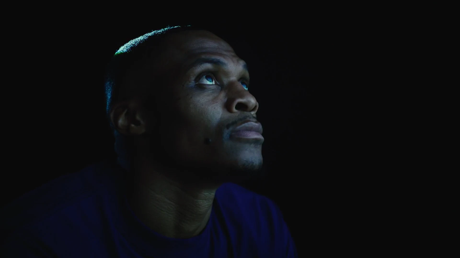 Russell Westbrook looking up at the projected film