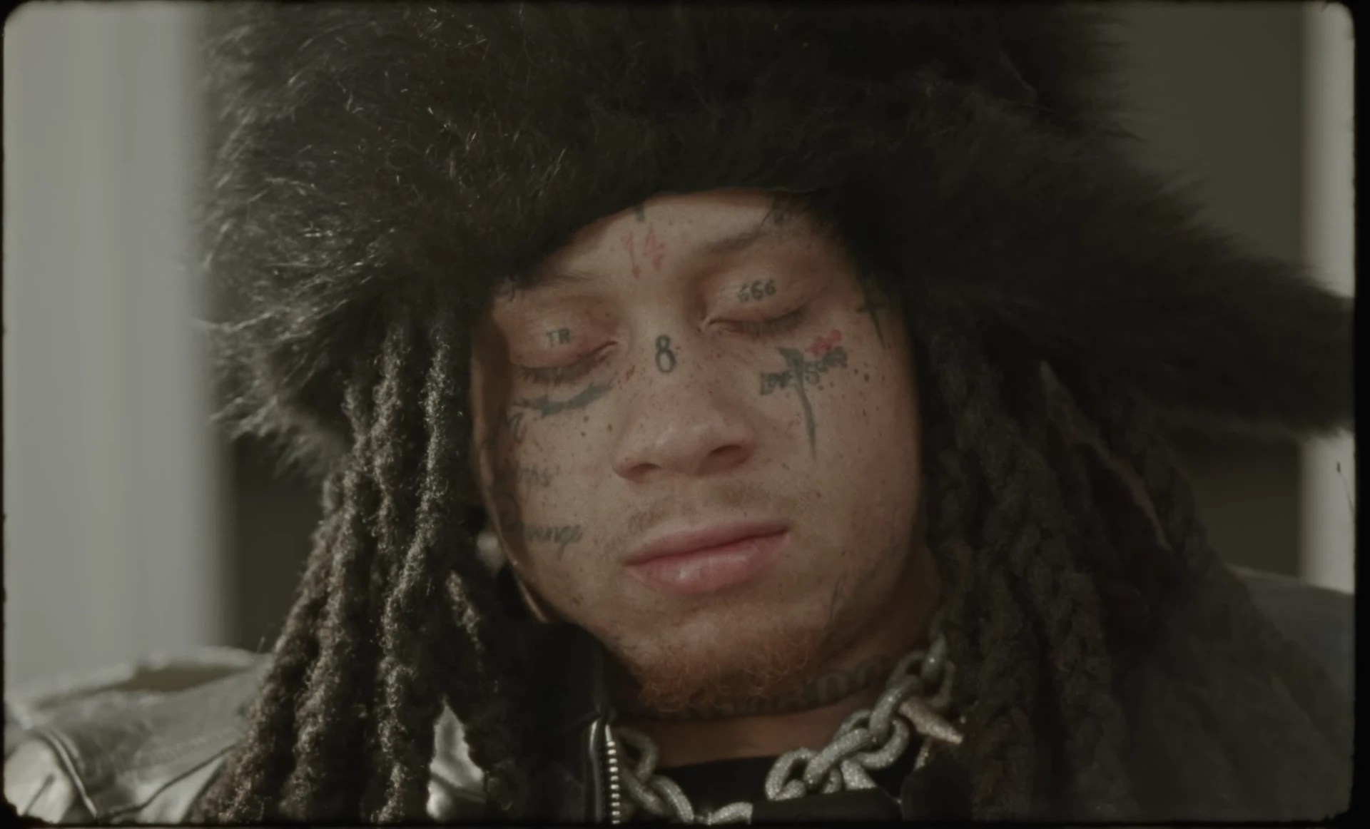 Trippie Redd wearing a fur-trimmed hood