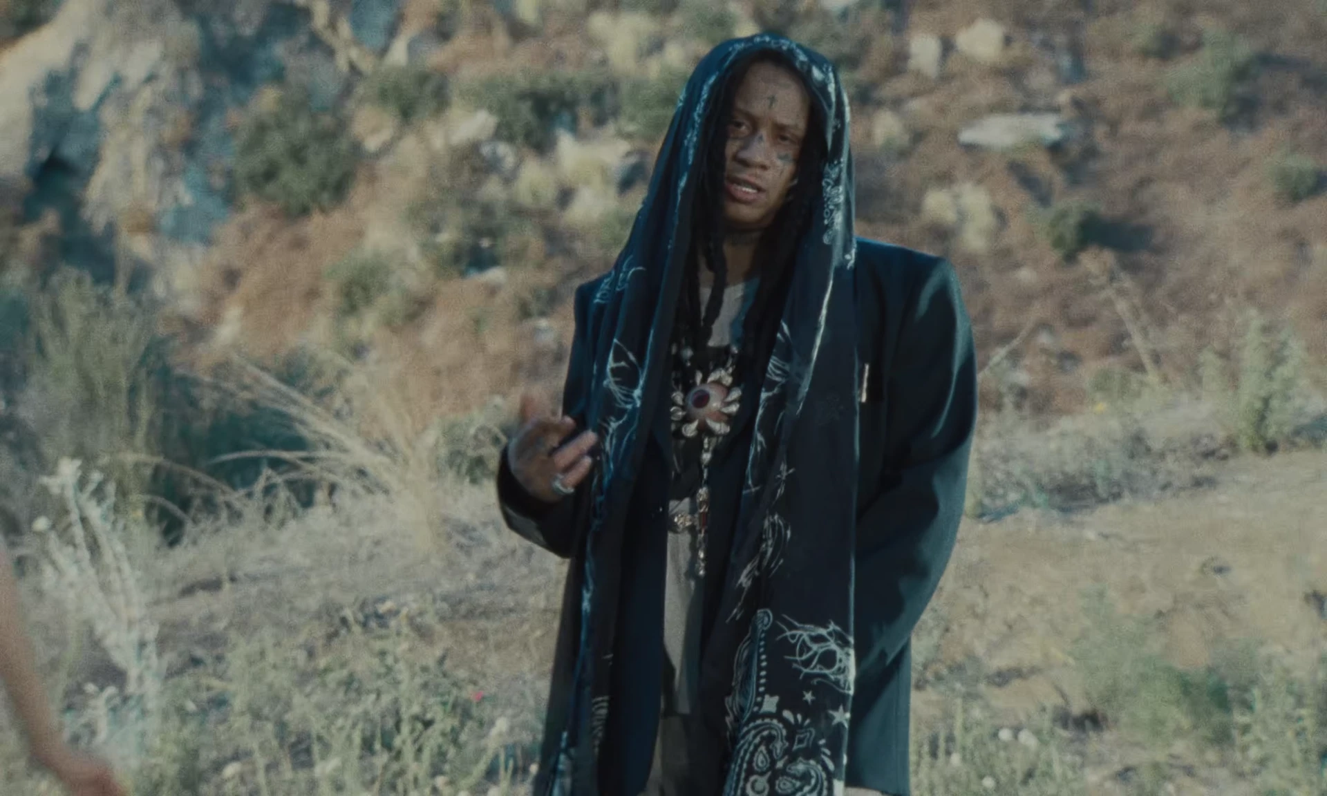Trippie Redd performing in the mountain landscape