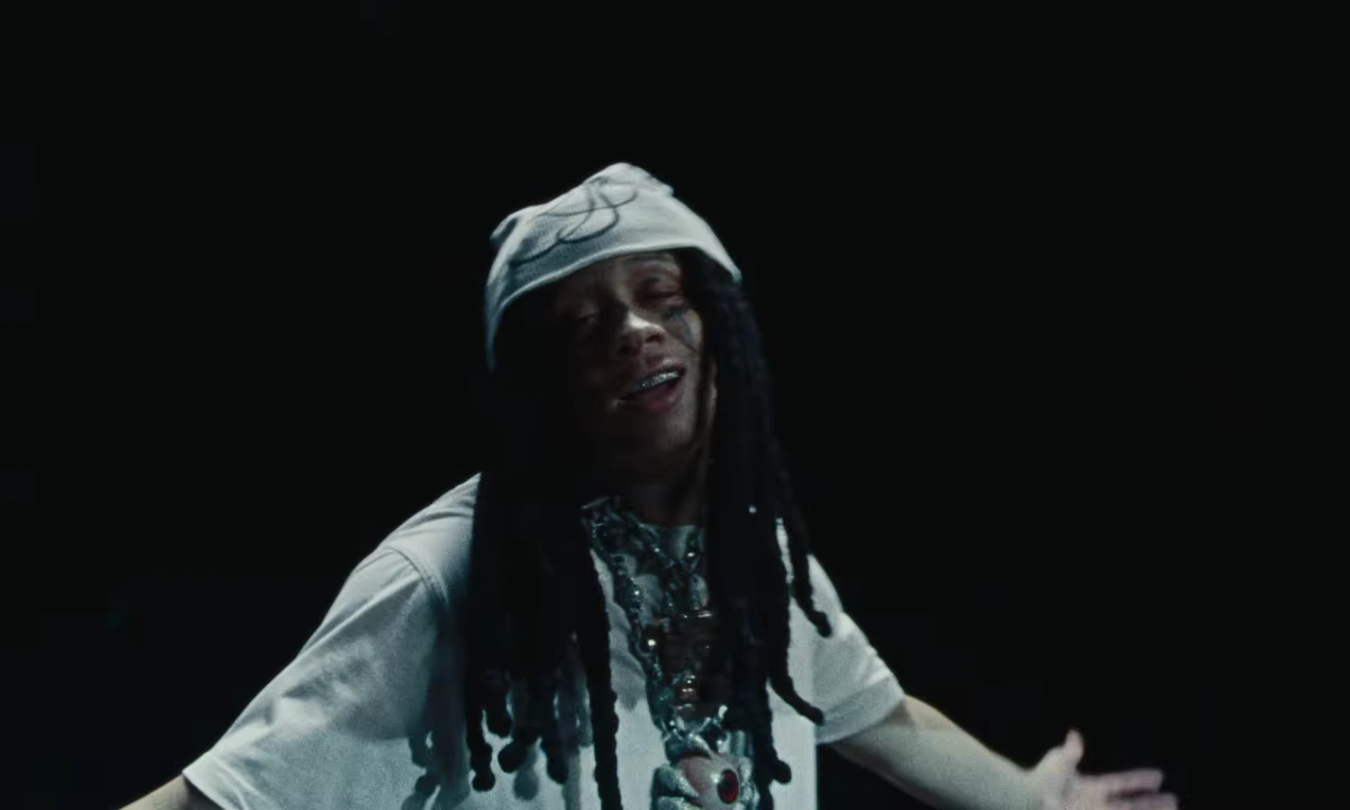Trippie Redd performing on the dark stage