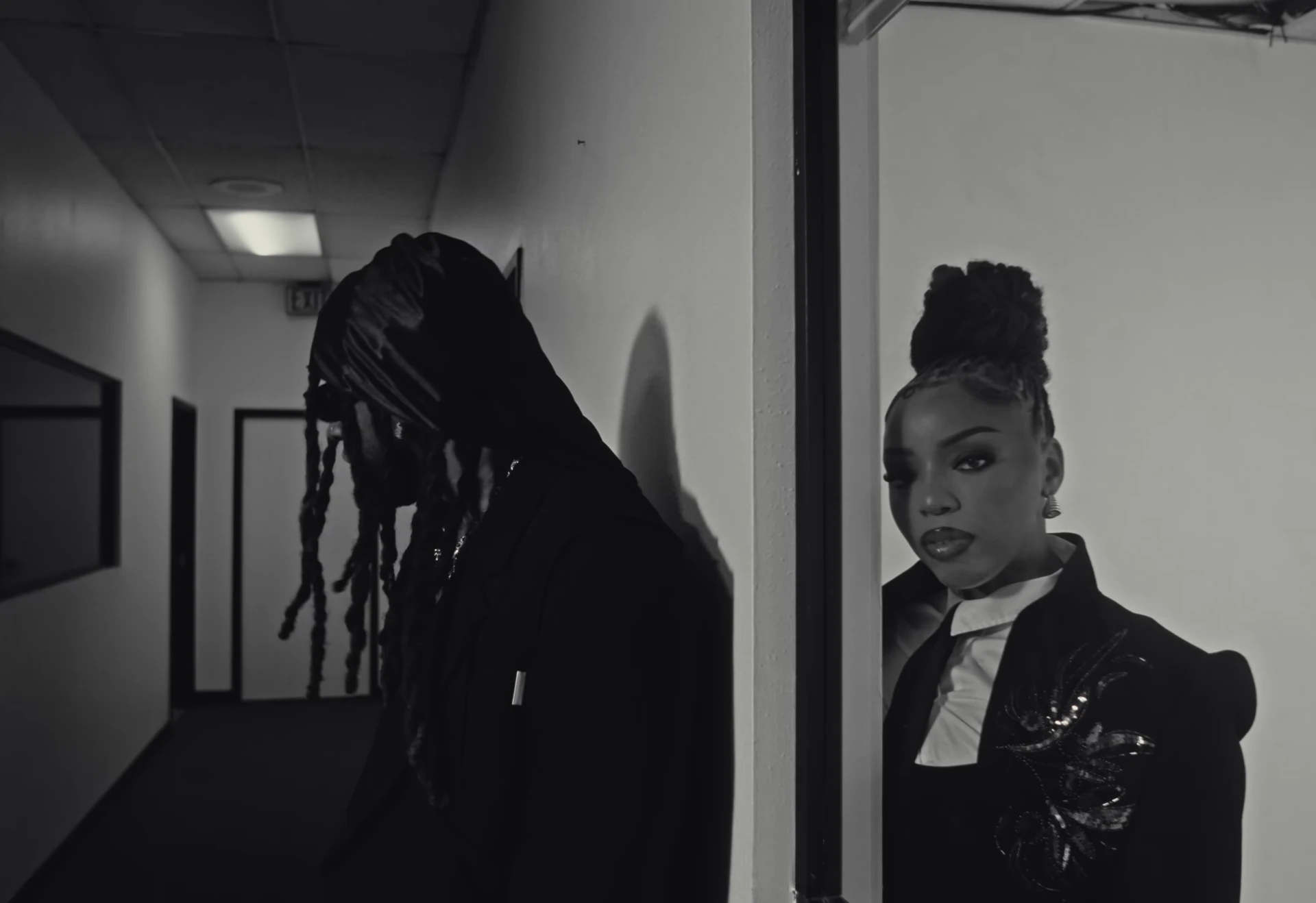 Ty Dolla $ign and Chlöe framed in the office doorway